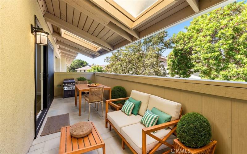 Covered Balcony Offers Outdoor Living Options in this Virtual Staged Photo - Not Sure About the BBQ on the Patio - please refer to the HOA CC&R's before you light er up