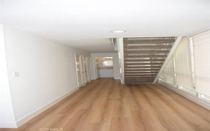 Downstairs Hallway from Living Room to Front Door, 1/2 Bath and Stairs to 2nd floor