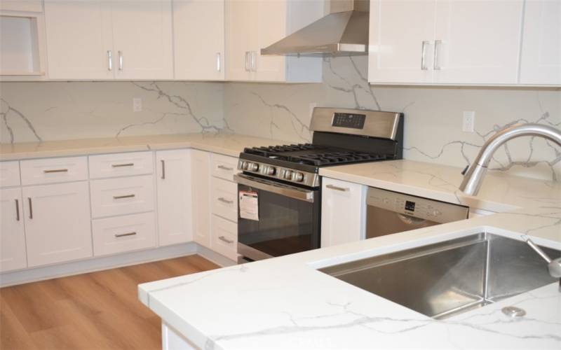 More kitchen with new dishwasher and range!