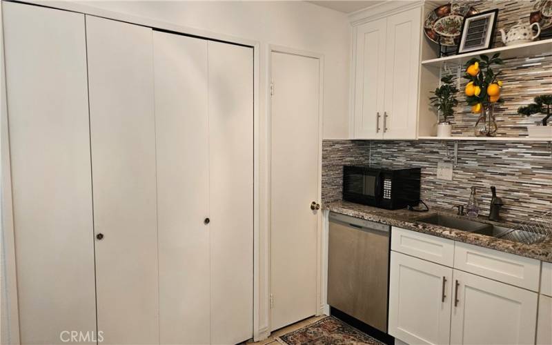 Doors to washer/dryer and pantry.