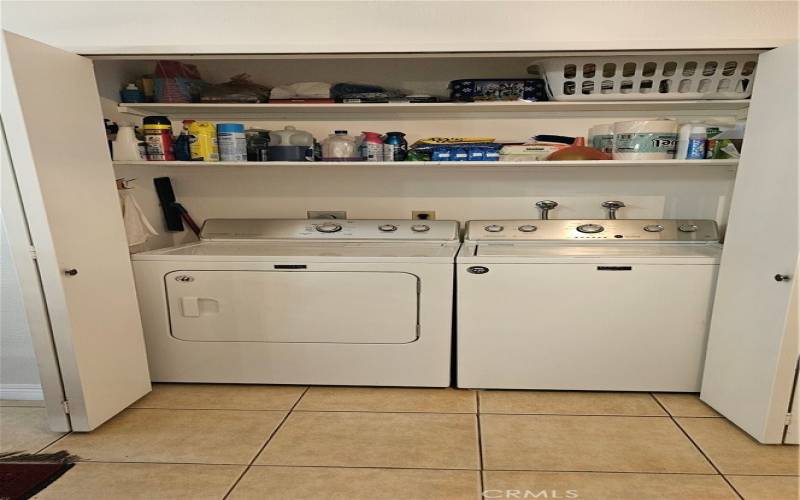 Inside laundry. Washer and dryer stay with the property.