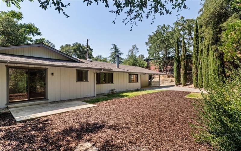 Primary bedroom has patio and backyard access as well.