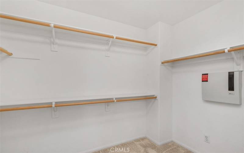 Walk in closet in primary bedroom