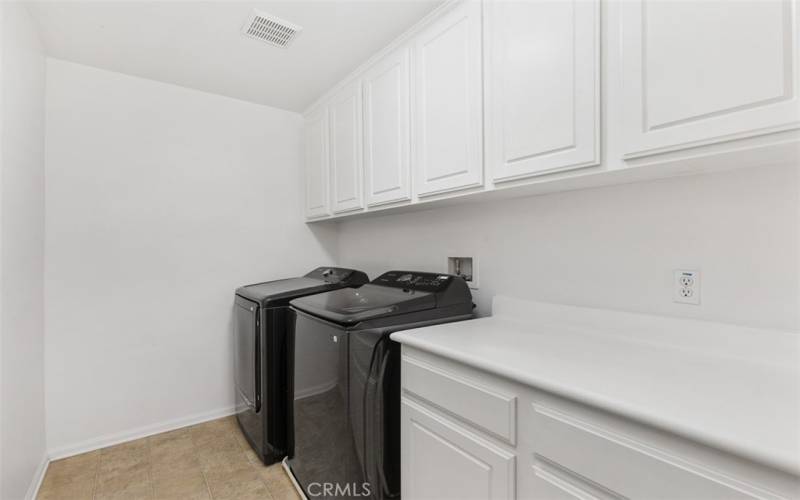 Laundry room with brand new washer and dryer