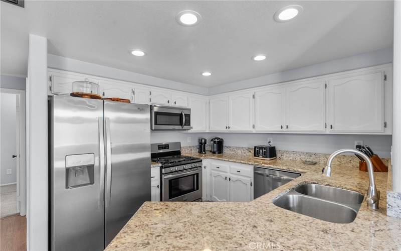 Kitchen with granite and stainless appliances