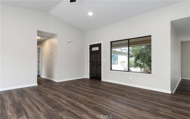 To the right of front entry window you can see the entry way to the family room off the living room.