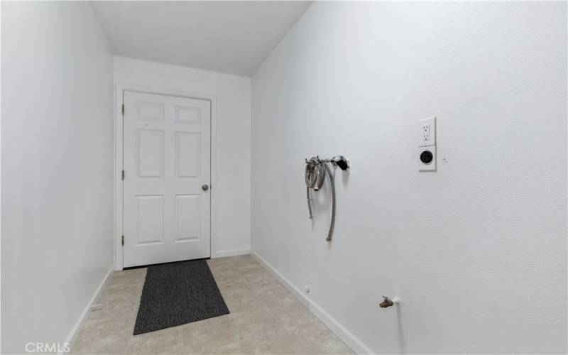 Large laundry room with garage access. 220 for dryer to take advantage of the solar.