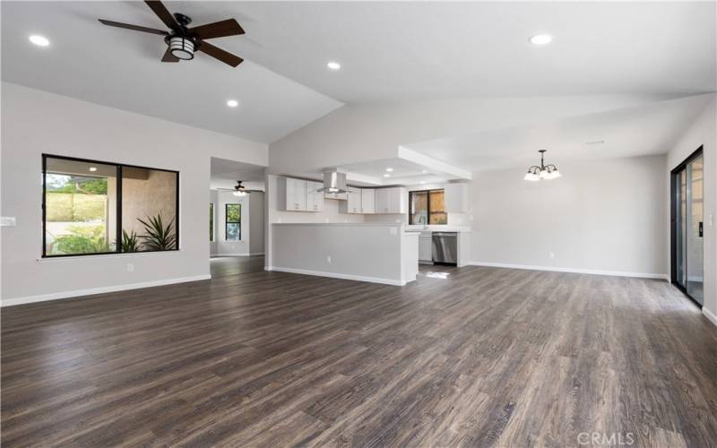 Living room seamlessly flows right into a large family room. The entry you can see here to family room to left of kitchen.