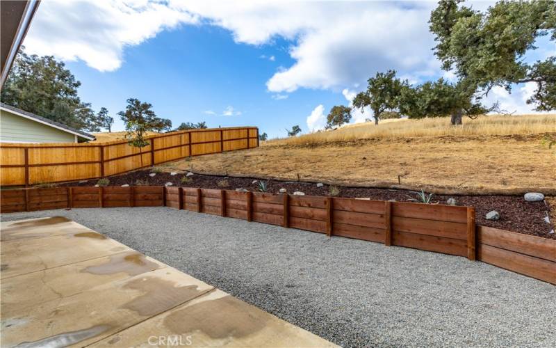 Large area for entertaining guests, new fencing adds extra privacy. Imagine terracing this more with lush landscape or maybe put in a pool for hot summer days. Property extends back further than landscaped area.