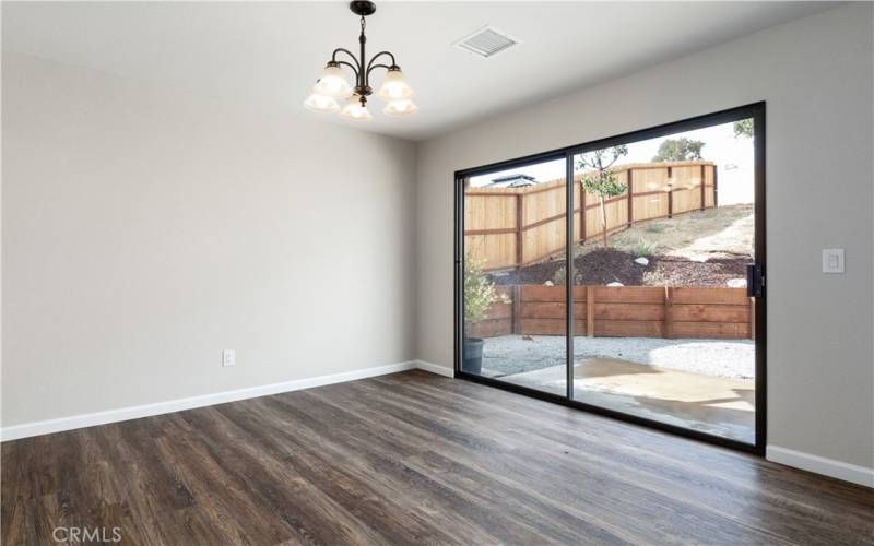 Dining area opens to backyard Look at the size of the sliders, more natural lighting ...