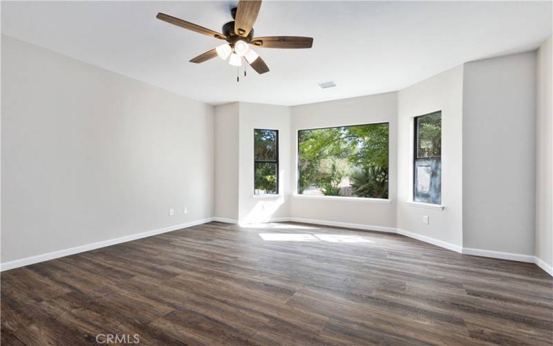 Family room overlooks lush private front yard and entry.