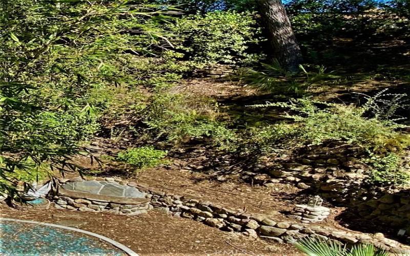 Stone walls and grotto, sea glass circular pit