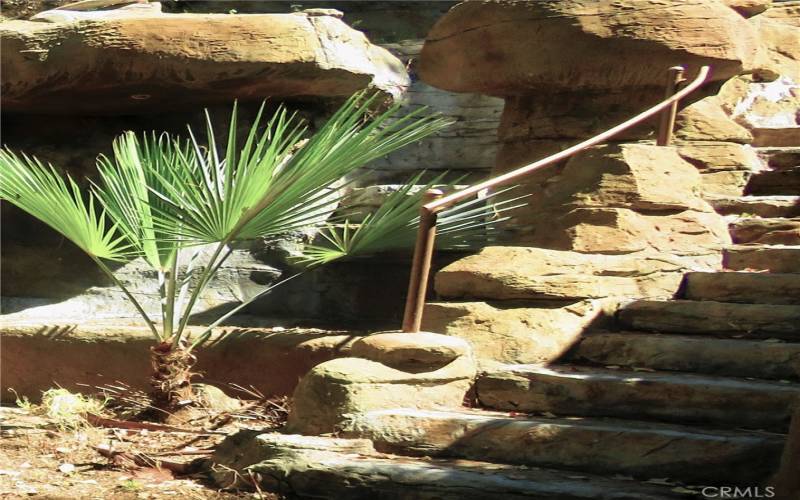 Bottom of stairs to waterfall