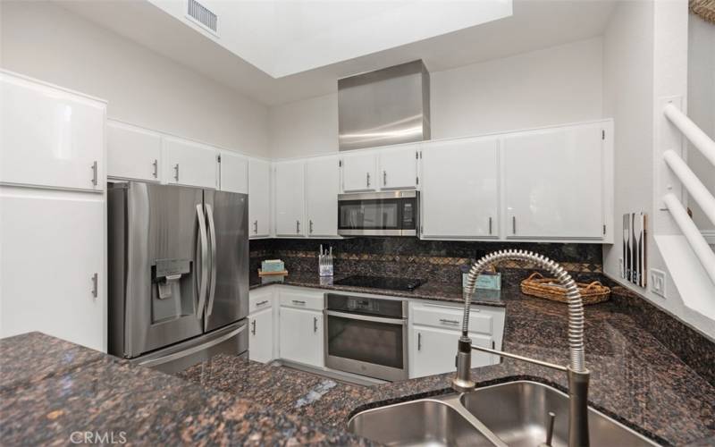 Beautiful kitchen with newly installed dishwasher and refrigerator