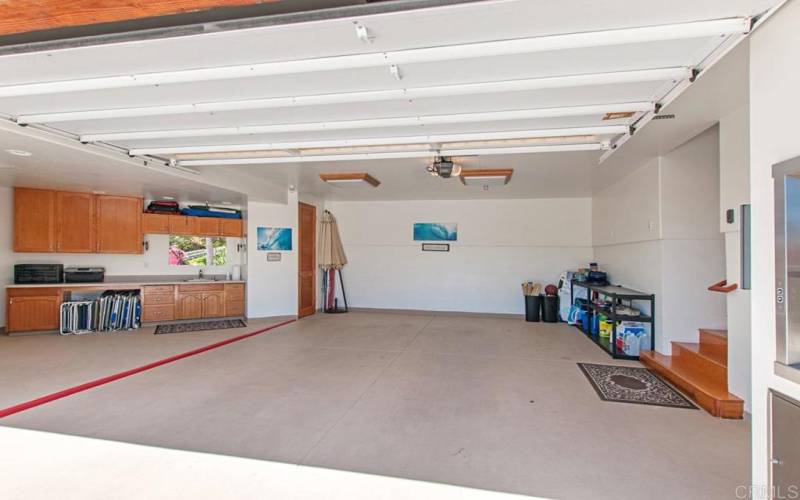 2 + Car garage - stocked with beach chairs, umbrellas and water toys.