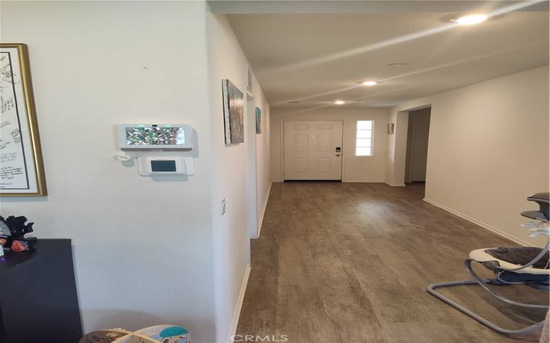 Main Hallway With Smart Home Devices on Wall.