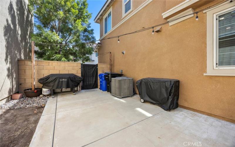 Private patio. Potential garden patch to the left. Gate leads to the 2 car attached garage.