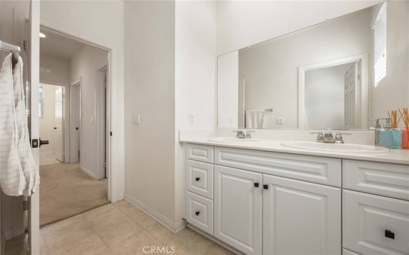 Looking from upstairs hall bathroom towards the laundry room