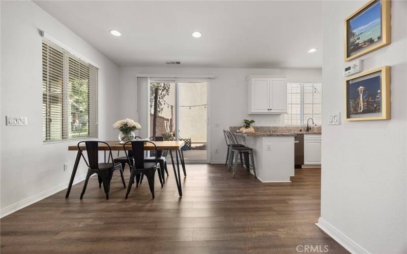 Dining area with recessed lighting.