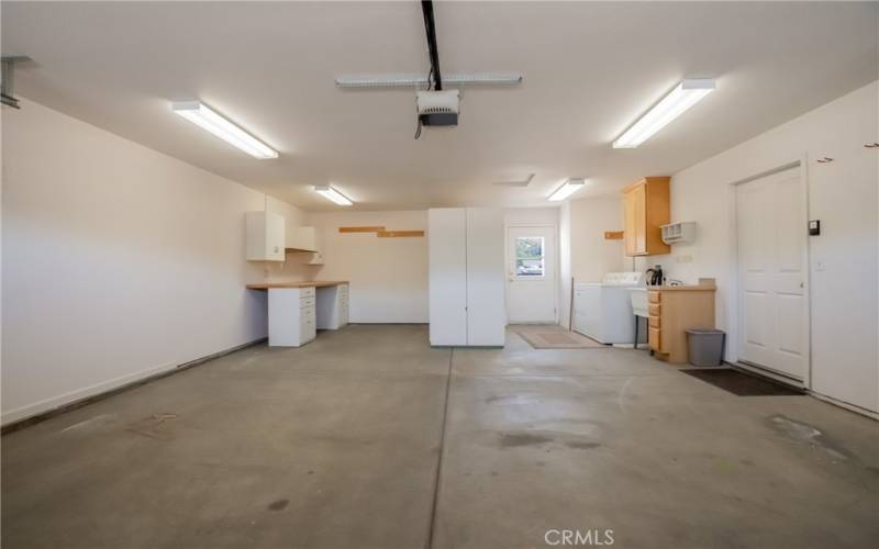 Washer and dryer with sink and cabinets