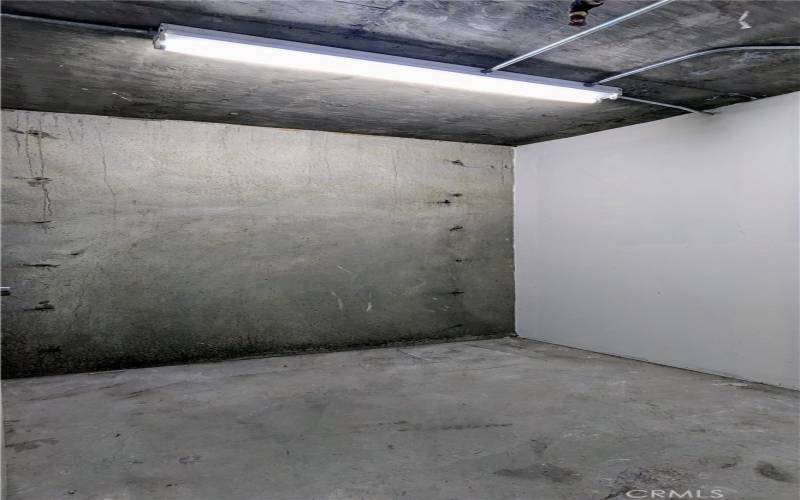 Private storage room in subterranean garage (included)