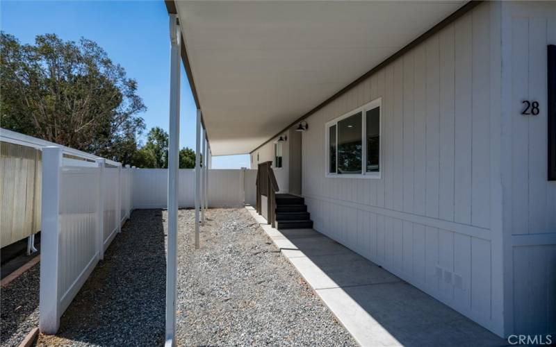 FRONT WALK WAY IS COVERED, VINYL FENCING IS BRAND NEW