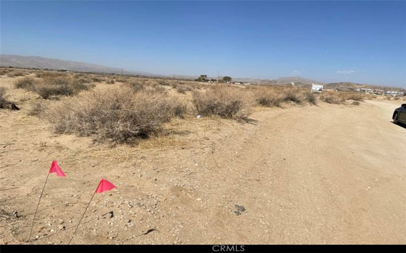 The property is marked with red flags