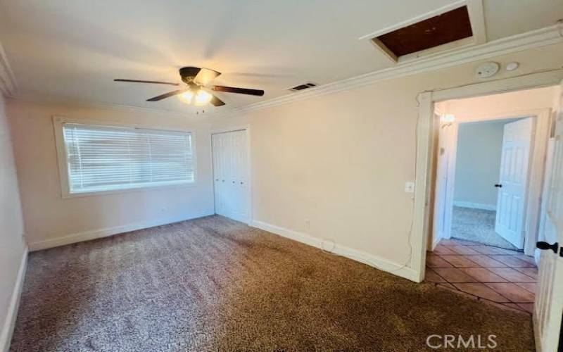 Bedroom on the left showing the hallway.