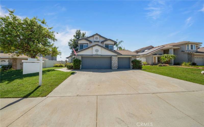 Three car extra large garage, insulated, finished, with built in Workbench and Desk and access to tons of attic storage space above the garage!