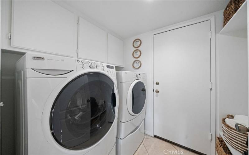 Main Floor Laundry Room with Built-in Cabinets, Shoe Shelves and Storage Shelves.

Classic Mud-Room!