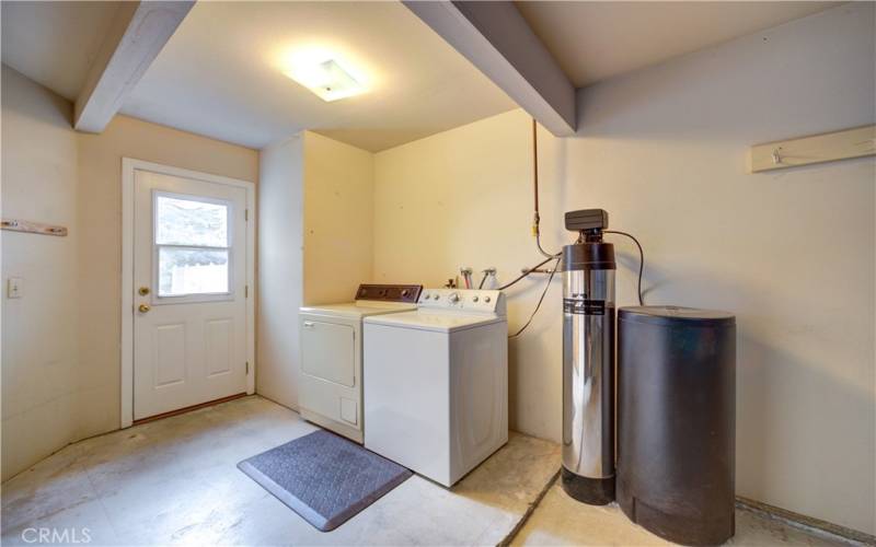 washer/dryer and water softener system in garage