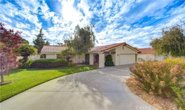 large driveway in the front of the home offering additonal parking