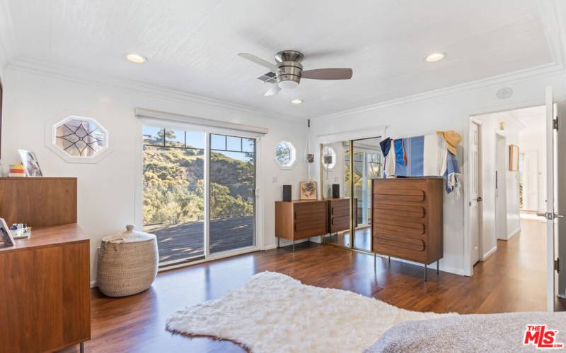 Master bedroom sliding doors lead to deck