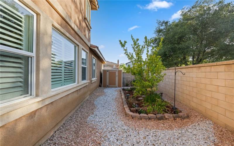 Side yard with shed for extra storage