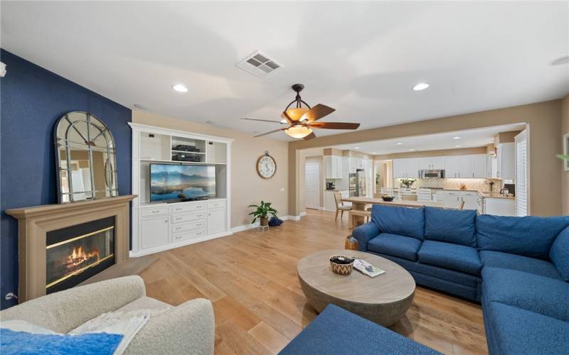 Another view of family room with fireplace & custom built-in