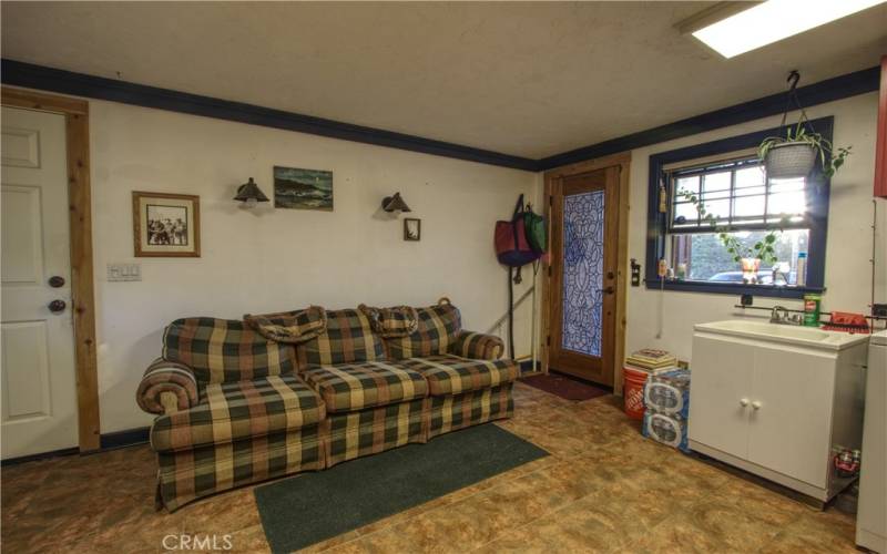 Laundry room/bonus space is on the lower level and adjacent to three car garage. The garage has a half bathroom