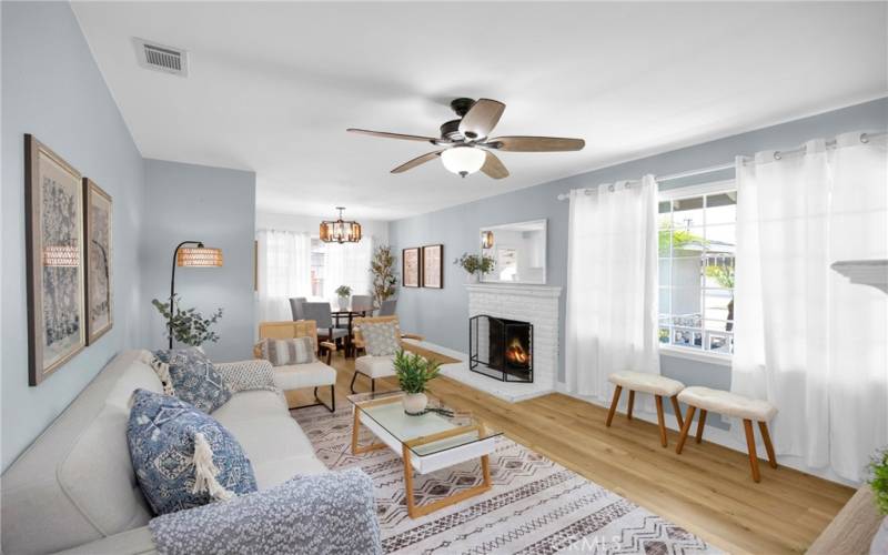 LIVING ROOM SPACE WITH FIREPLACE AND CEILING FAN