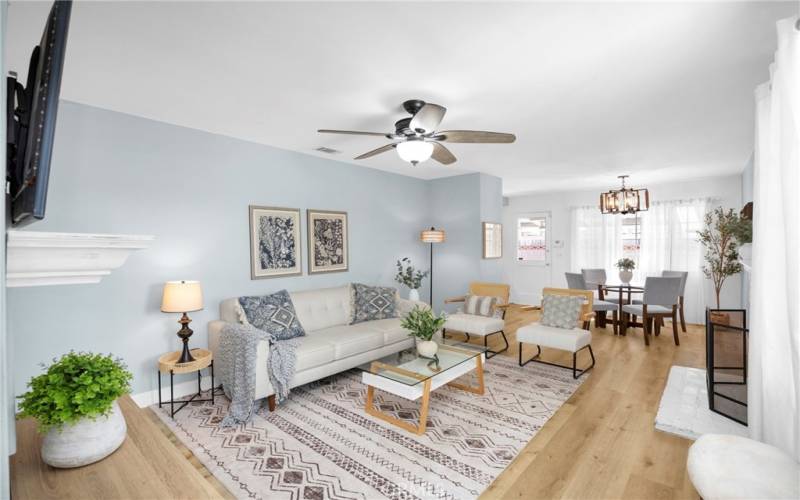 OPEN AND WARM LIVING ROOM SPACE WITH NEW VINYL FLOORING