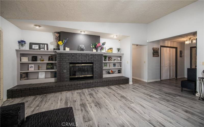 Great Room with custom built-in wall shelves.