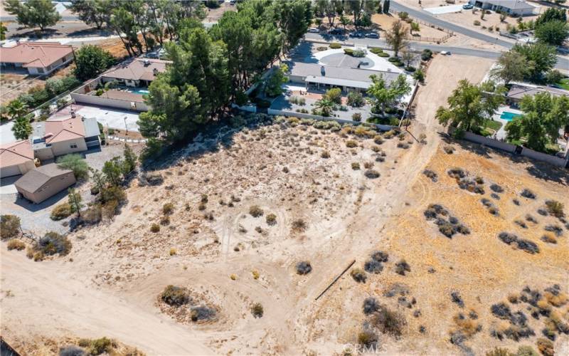 Your lot extend to the dirt access road to the northern property line. This view is looking south from the northern property line.