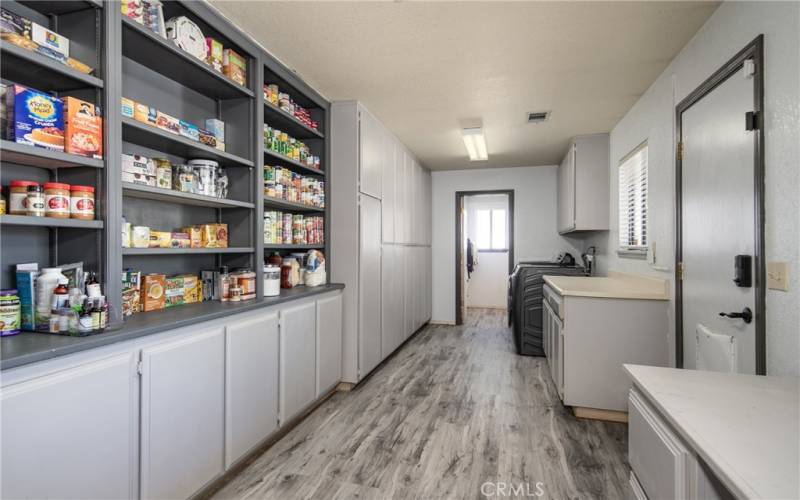 Yes!! This is the Laundry Room with an attached 3/4 bathroom and you will love the all storage space. Even has a doggie access door for your fur babies and a separate door to the backyard and garage.