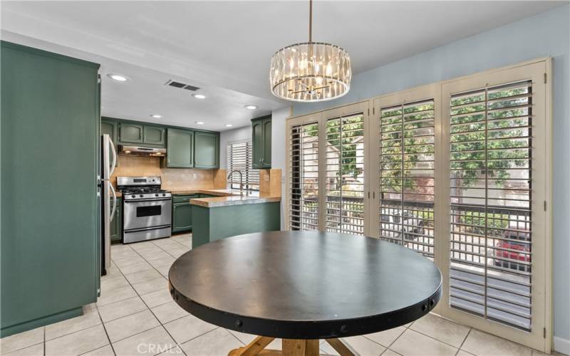 Kitchen with a sunny breakfast nook and north facing patio gets morning sun and afternoon shade.