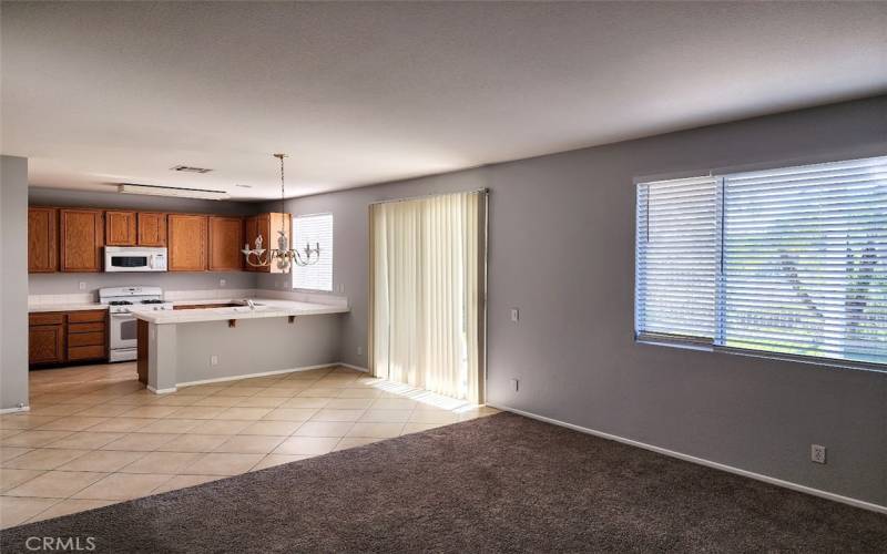 Kitchen and dining area opening into living room