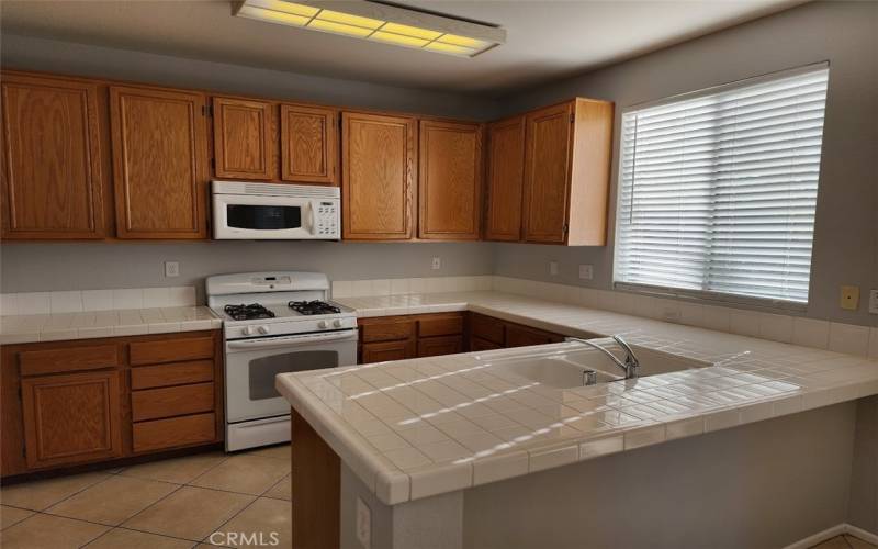 Spacious kitchen with new stainless steel range (not pictured)