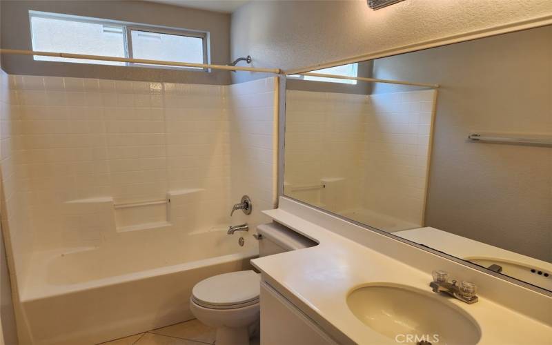 Upstairs bathroom with shower over tub