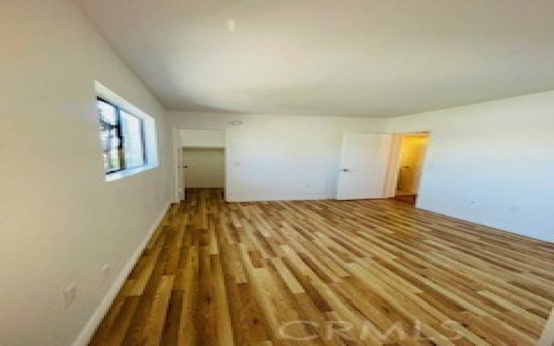 Primary Bedroom, with entry door to Bathroom.