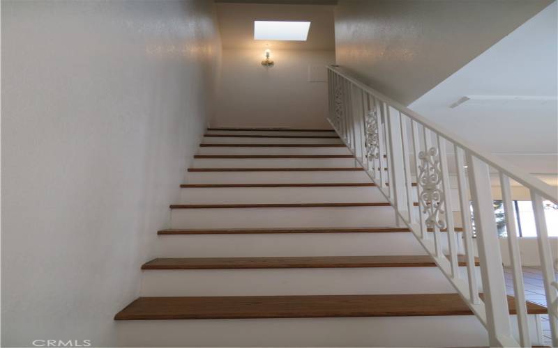 Staircase, leading up to the private bedrooms.