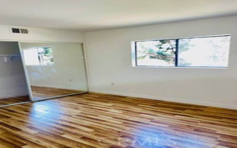 Second bedroom, has NEW flooring. Lots of natural light from window and peek a boo view to mountains.