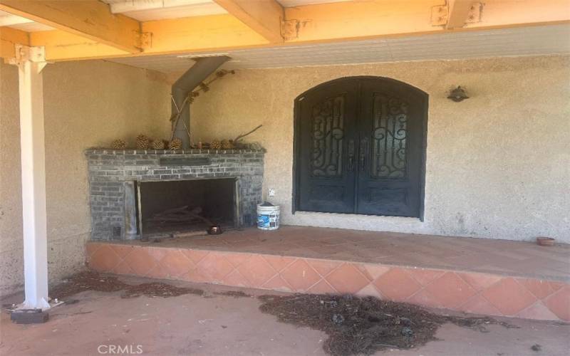 Outdoor patio with fireplace.