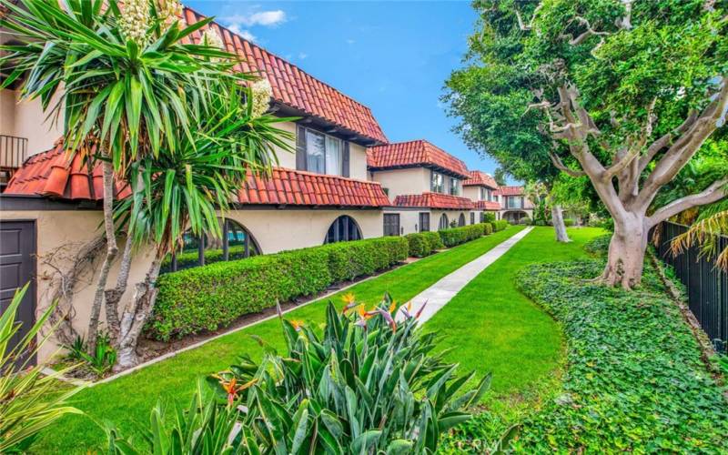 Overlooking a lush greenbelt, walking paths, and Association Pool